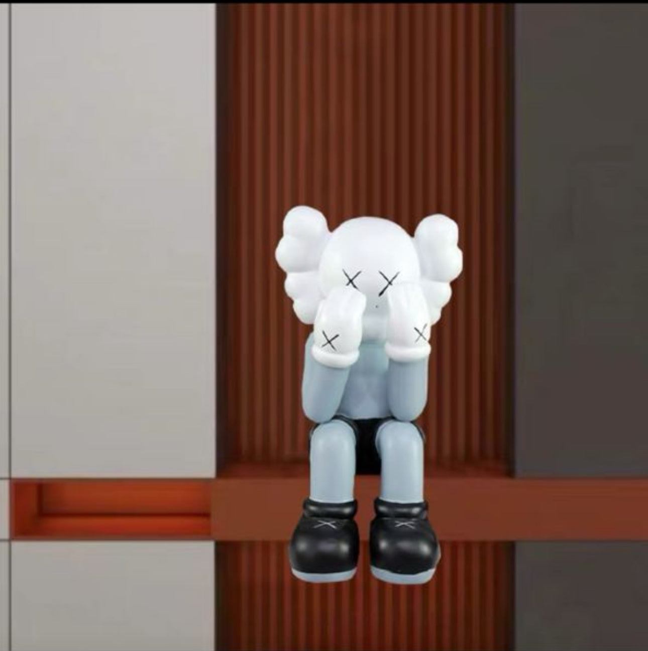 Sitting KAWS Figure