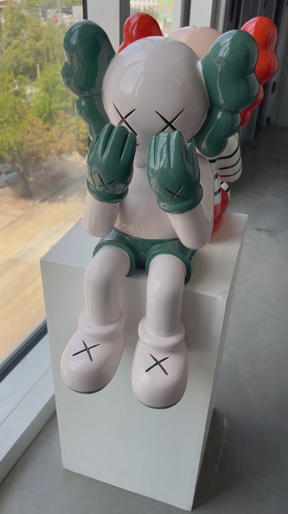 Sitting KAWS Figure